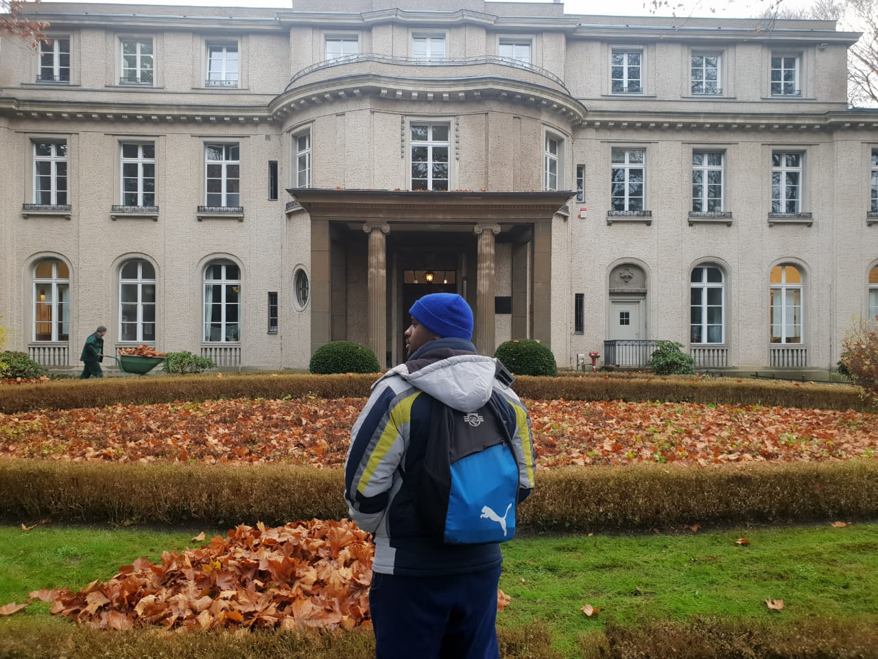 Muziwakithu Maseko standing outside Wannsee House near Berlin