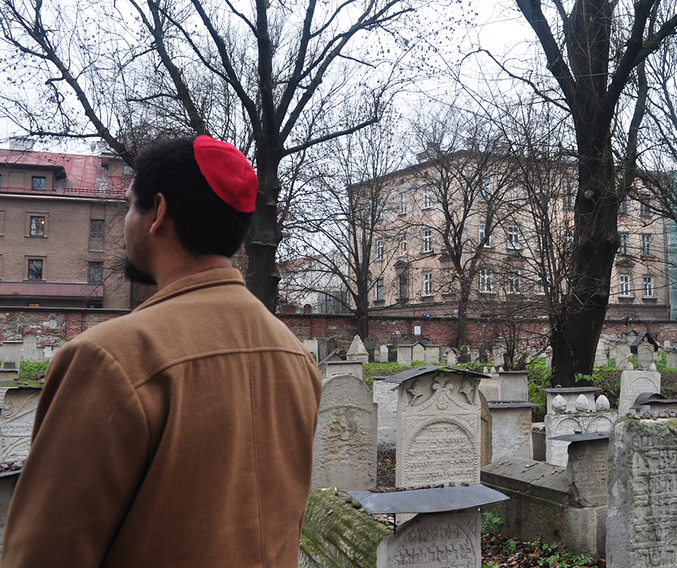 Student stands in graveyard